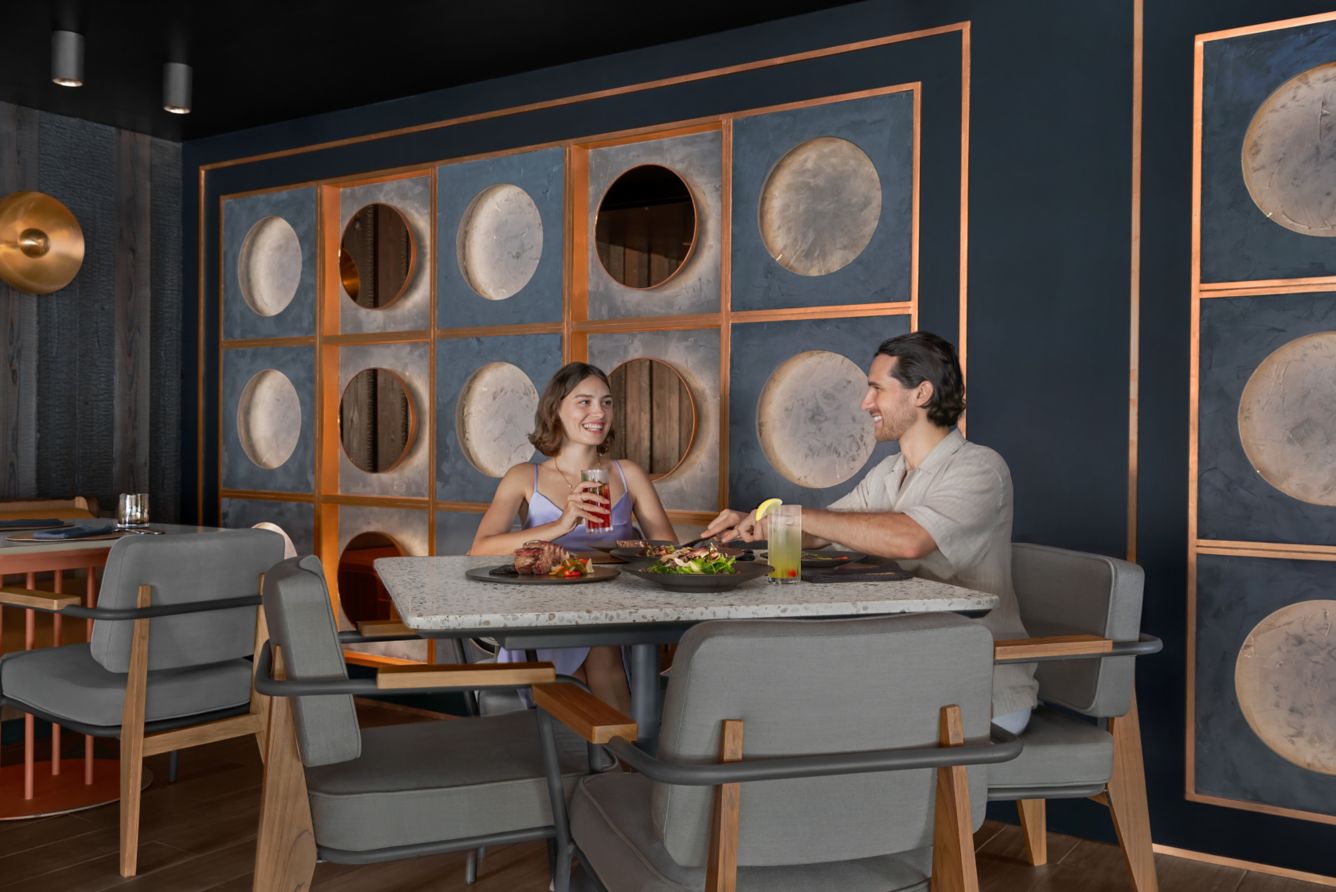 A couple enjoying their meal at Courtyard by merriot Patong